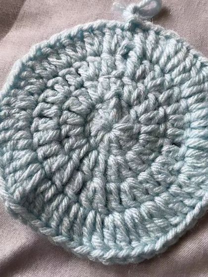 This flat circle is the starting point for so many projects, like coasters, baskets, or the base of a toy. This student has done a great job keeping their stitches even.