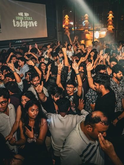 A high-angle shot of the dance floor damage at Boho Koramangala. A packed venue with people dancing and singing along is the best sign of a successful night.