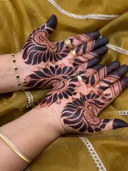 This is the result of my homemade, natural henna cones. The stain comes out so deep and dark. This bold Arabic design shows how the color develops, giving you a rich, long-lasting mehndi. Mashallah, what a color.