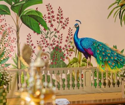 Another view of the magnificent peacock art on the mandap backdrop. The surrounding floral and plant motifs are inspired by traditional Pichwai paintings, adding an artistic flair to the wedding decor.