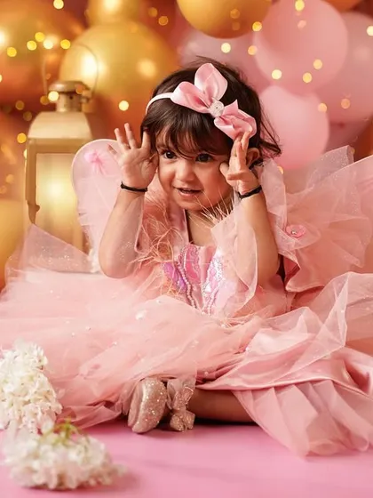 So much personality! We love capturing the playful and cheeky expressions that make your toddler unique during their birthday photoshoot.
