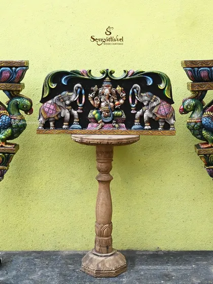The full composition of the Gaja Ganesh panel and parrot brackets, showing how they can be mounted to create a beautiful and auspicious wall display.