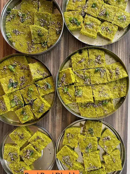 Trays of my special Pani Puri Dhokla, a unique fusion snack that's always a hit at parties.
