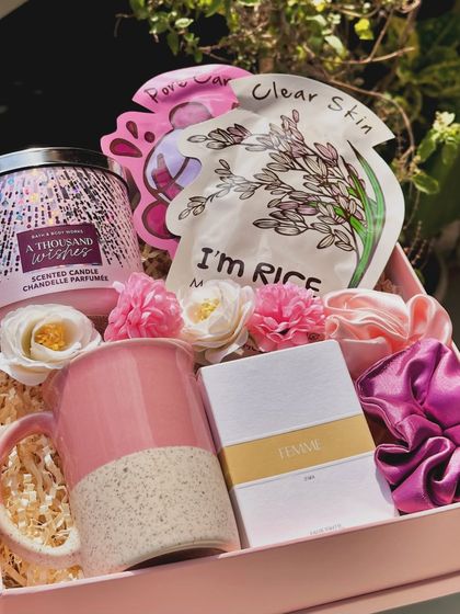 The "Scent of Love" hamper is a perfect gift for her. It features a large 3-wick candle from Bath & Body Works, a Zara mini perfume, face sheet masks, a coffee mug, and scrunchies.
