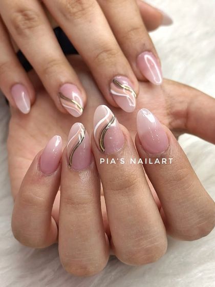 A soft, milky gel color with minimal gold and white chrome lines. This design is the definition of understated elegance.