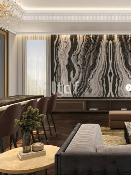A wider perspective of the living area, showing how the dramatic stone feature wall integrates with the bar and seating. The design maintains a cohesive language of refined materials and natural light, ensuring the space feels unified and thoughtfully composed.