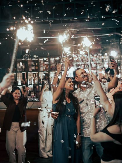 Celebrating with the crowd as sparklers and confetti fill the room. These are the peak moments that make a night unforgettable.