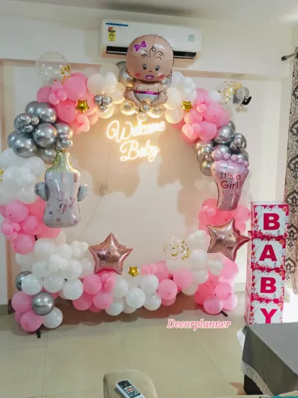 There's nothing like the joy of bringing your little one home. I designed this beautiful circular balloon arch in soft pinks and shimmering silvers, centered with a "Welcome Baby" neon sign to create the perfect, warm welcome for a new princess.