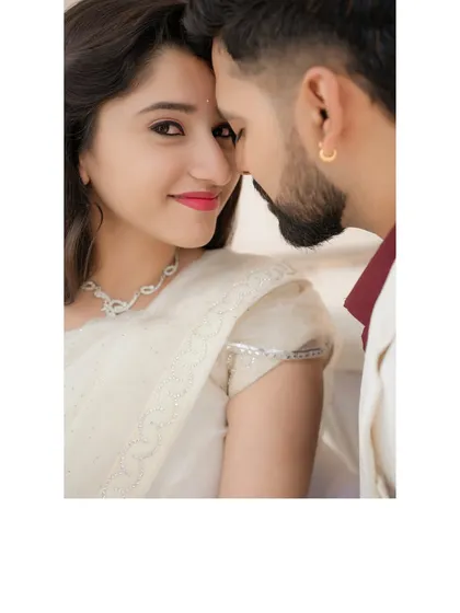 A stunning close-up portrait of the bride. Her direct gaze and the intimate framing create a powerful and captivating image that highlights her beauty and confidence.