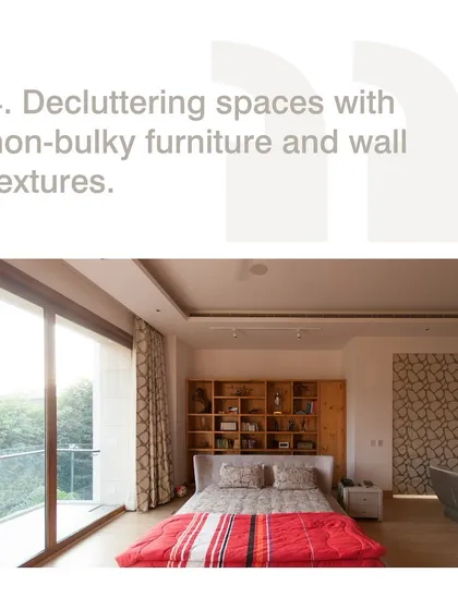 We declutter spaces with non-bulky furniture and varied wall textures. This approach, seen in this bedroom, creates a sense of calm and spaciousness while adding visual interest.