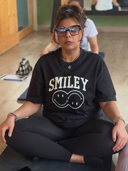A participant sits ready for our journaling session, embodying the workshop's blend of focused intention and lighthearted self-discovery.
