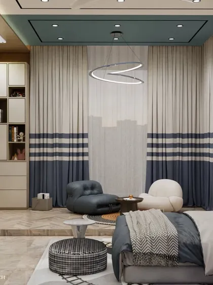 This view showcases the cozy reading and play corner, complete with comfortable, modern floor chairs and custom two-toned curtains. The raised platform helps to define the play zone from the rest of the room.