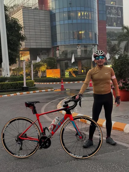 A rider and his red Giant TCR bike, ready for action.