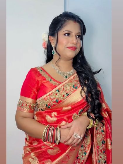 A smiling portrait of the client, looking graceful and happy.