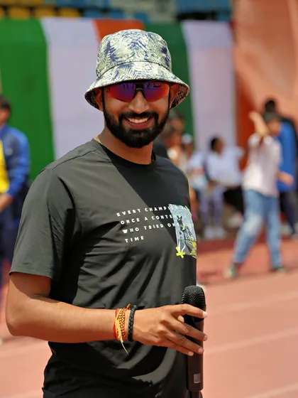 A smile on my face while managing a large-scale event. I love the energy of race day and thrive on the challenge of making it a success.