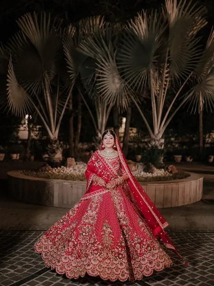 A bridal portrait should be iconic. I captured Khyati in her magnificent red lehenga, creating a timeless image that showcases her elegance and the grandeur of her wedding night. This is the classic, yet unstiff, portraiture I promise.