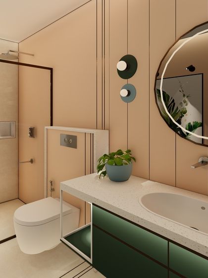 A different angle of the peach and green bathroom, highlighting the minimalist vanity and the soft, ambient lighting from the mirror. The design is simple, elegant, and functional.