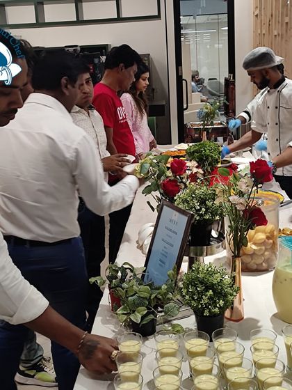 Guests lining up for fresh Thandai, a traditional Holi drink, at the Kult App celebration. I believe in incorporating authentic touches to make festive events more memorable.