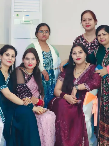 A group of ladies posing for a photo at a family function. I take great group shots of friends and family enjoying the celebration.