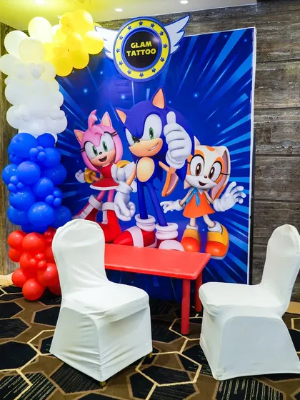 A "Glam Tattoo" station with a Sonic-themed backdrop for guests to get fun, temporary tattoos.