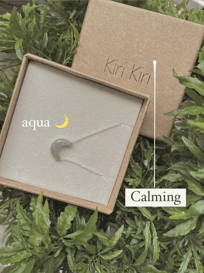 My aquamarine Luna pendant, boxed and surrounded by greenery. This calming stone is perfect for relaxing the mind and soothing the mood.