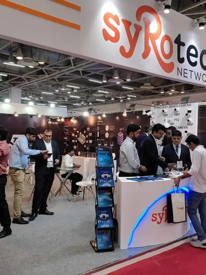 A busy scene at our booth during the UP International Trade Show, with attendees exploring our networking and surveillance solutions.
