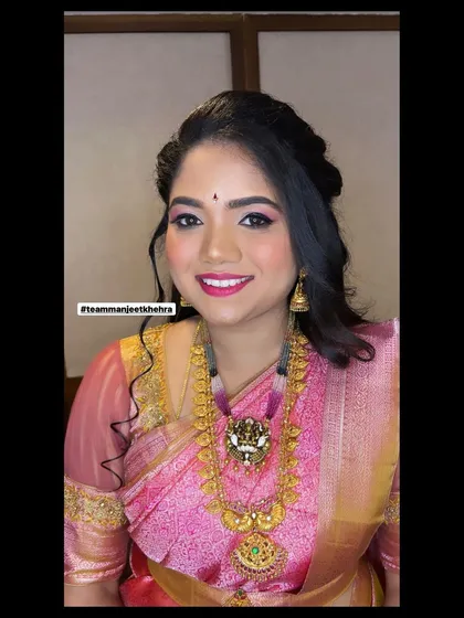 This reception look for the bride's sister is all about soft, romantic glamour. The shimmery eyes and bright smile show how confident and beautiful she feels.