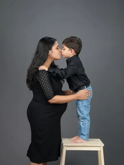 A beautiful moment of love as a big brother-to-be gives his mom a sweet kiss. Family maternity sessions are a wonderful way to capture the love that’s already there as you wait for the new arrival.