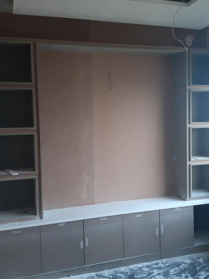 The framework for a large storage and display unit in an office. This work-in-progress shot shows the underlying structure before painting and finishing, highlighting the importance of solid carpentry.