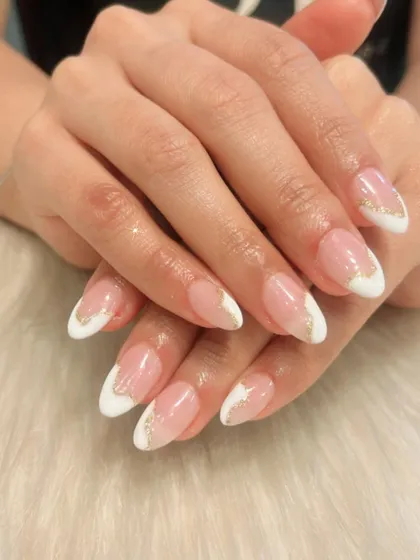 For a touch of glamour, I added a delicate line of gold glitter along the smile line of this French manicure. It’s a simple way to elevate the classic design for a special occasion.