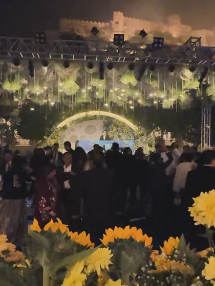 Performing against the historic backdrop of a fort, I blend modern beats with a timeless setting. I handle all the technical logistics for destination weddings to create magical experiences like this.
