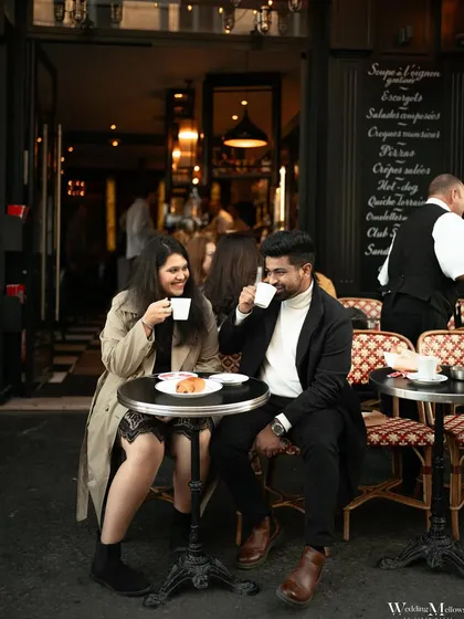 Sharing coffee and croissants at a classic Parisian cafe. This shot tells a story of a day spent exploring the city, capturing a simple, authentic moment of connection for Varun and Aishwarya.