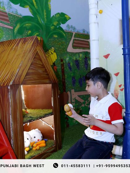 A quiet moment of play in our pretend farm area, a charming corner for imaginative fun.