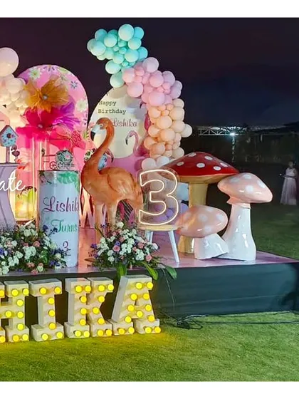 The other side of the flamingo stage, featuring a light-up number '3' and another flamingo prop. The whole setup was designed to be vibrant and playful.