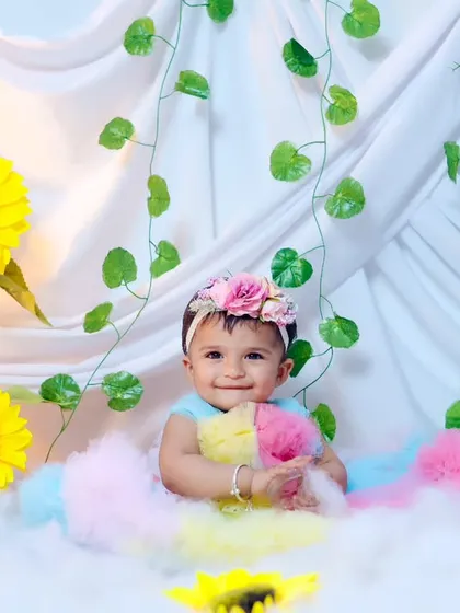 A happy, smiling portrait from the sunflower and clouds session.