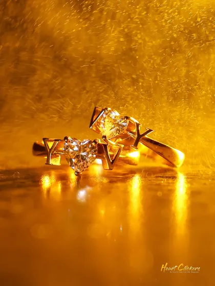 It is all in the details. A close-up of custom heart-shaped engagement rings, symbolizing the start of a new chapter.