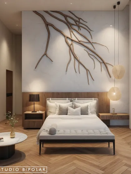In this bedroom for a holiday home in Kangra, we embraced warm minimalism. A custom-designed sculptural branch art piece made of wood is set against a clean marble wall, creating a serene focal point that brings the beauty of nature indoors.