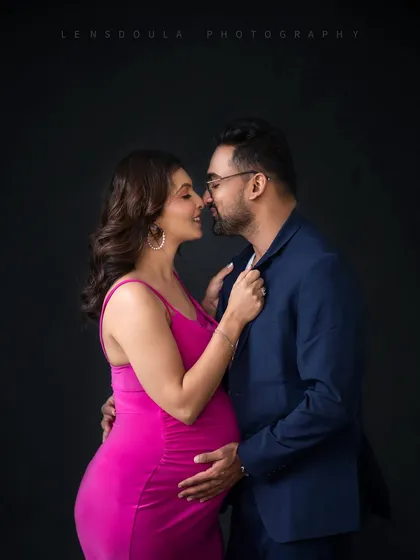 A tender, intimate moment between the parents-to-be. This close-up shot focuses purely on emotion and connection.