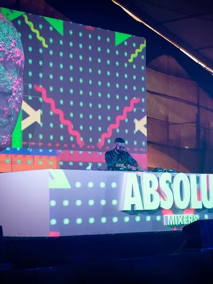 A shot of me at the Absolut stage at Sunburn, with incredible custom visuals projected onto a giant head sculpture.