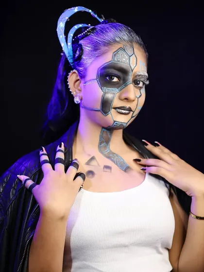 A close-up of the robotic face paint, showing the detailed line work.