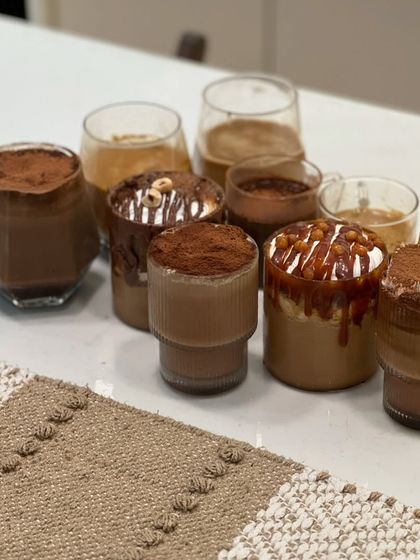 Another angle of the delicious results from a coffee workshop. Each glass holds a different creation, ready to be enjoyed. It’s a feast for the eyes and the palate.