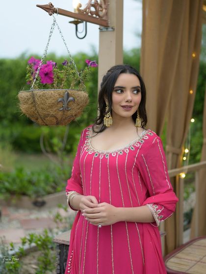Another beautiful portrait. The lighting highlights the soft glow on her skin and the subtle details of the makeup.