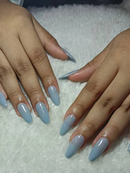 These long, stiletto extensions in a shimmering powder blue are so dreamy. A simple color can make a huge statement with the right shape.