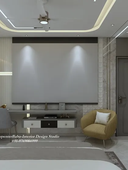 The TV wall in this bedroom is designed to be a feature in itself, with a projector screen that rolls down for an immersive viewing experience.