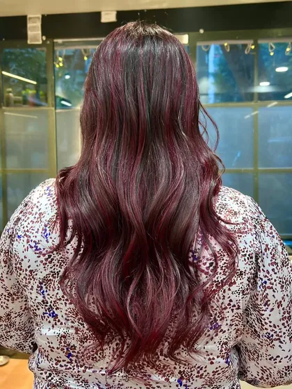 Sassy, classy, and cherry red. This vibrant red has beautiful depth and shine, styled with soft waves.