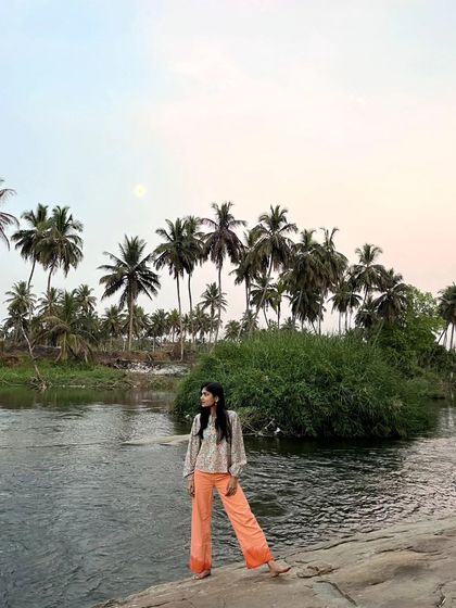 Standing by the river as the moon appears in the twilight sky. The transition from day to night is another magical time for artists.
