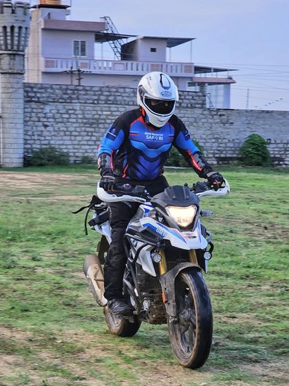 A front view of a rider navigating the grassy training area at The KGF Trails. Even flat terrain requires specific skills to handle at speed, which we cover in our sessions.