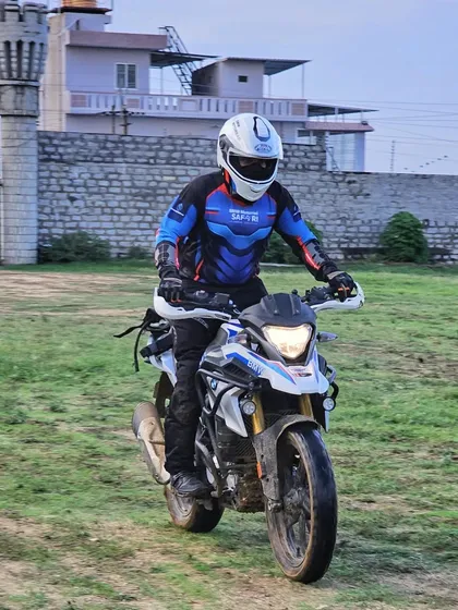 A front view of a rider navigating the grassy training area at The KGF Trails. Even flat terrain requires specific skills to handle at speed, which we cover in our sessions.