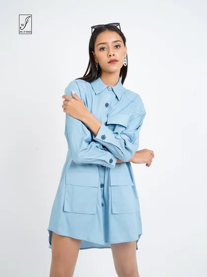 A front-facing shot that clearly displays the pocket details and button-down front of the shirt dress.