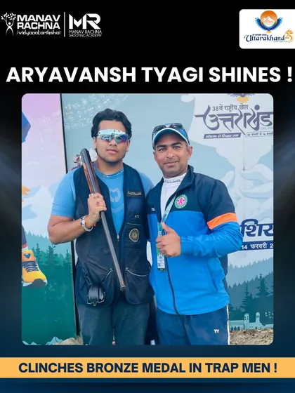 Our shooter Aryavansh Tyagi with his coach after winning the Bronze Medal at the 38th National Games, highlighting the strong bond and effective mentorship within our program.